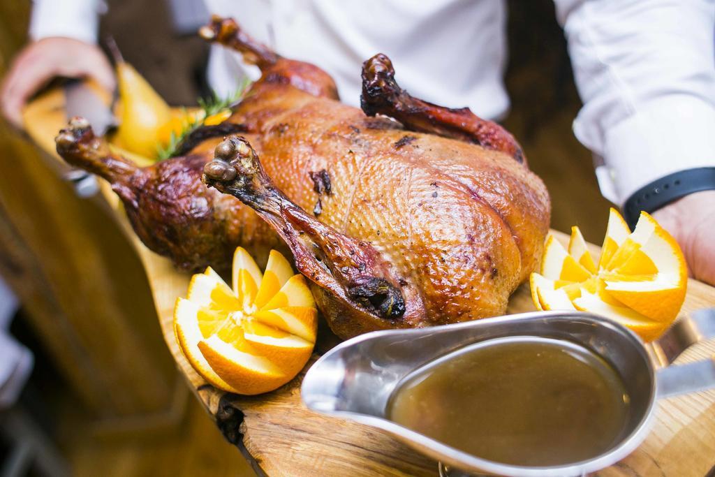Hotel Gdansk Boutique Bagian luar foto A roast duck with orange sauce